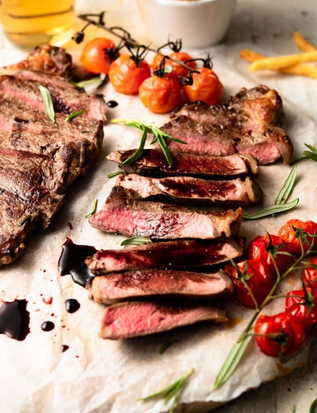 sliced new york strip steak on a plate