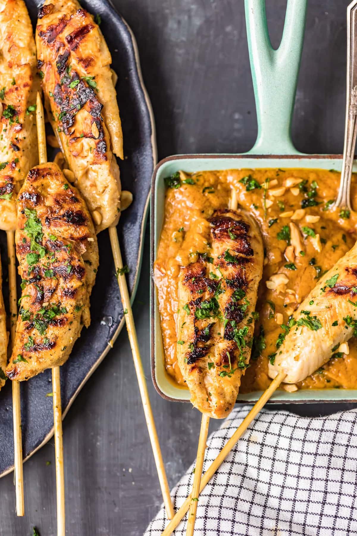 chicken satay dipped into peanut sauce