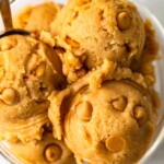 a close up view of edible peanut better cookie dough with peanut butter chips