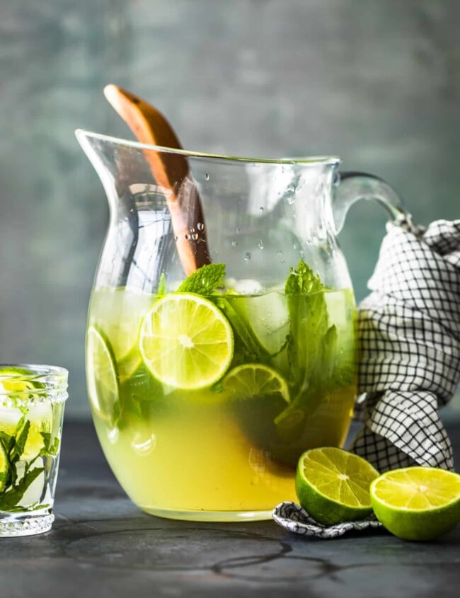 a pitcher of mojitos on a table