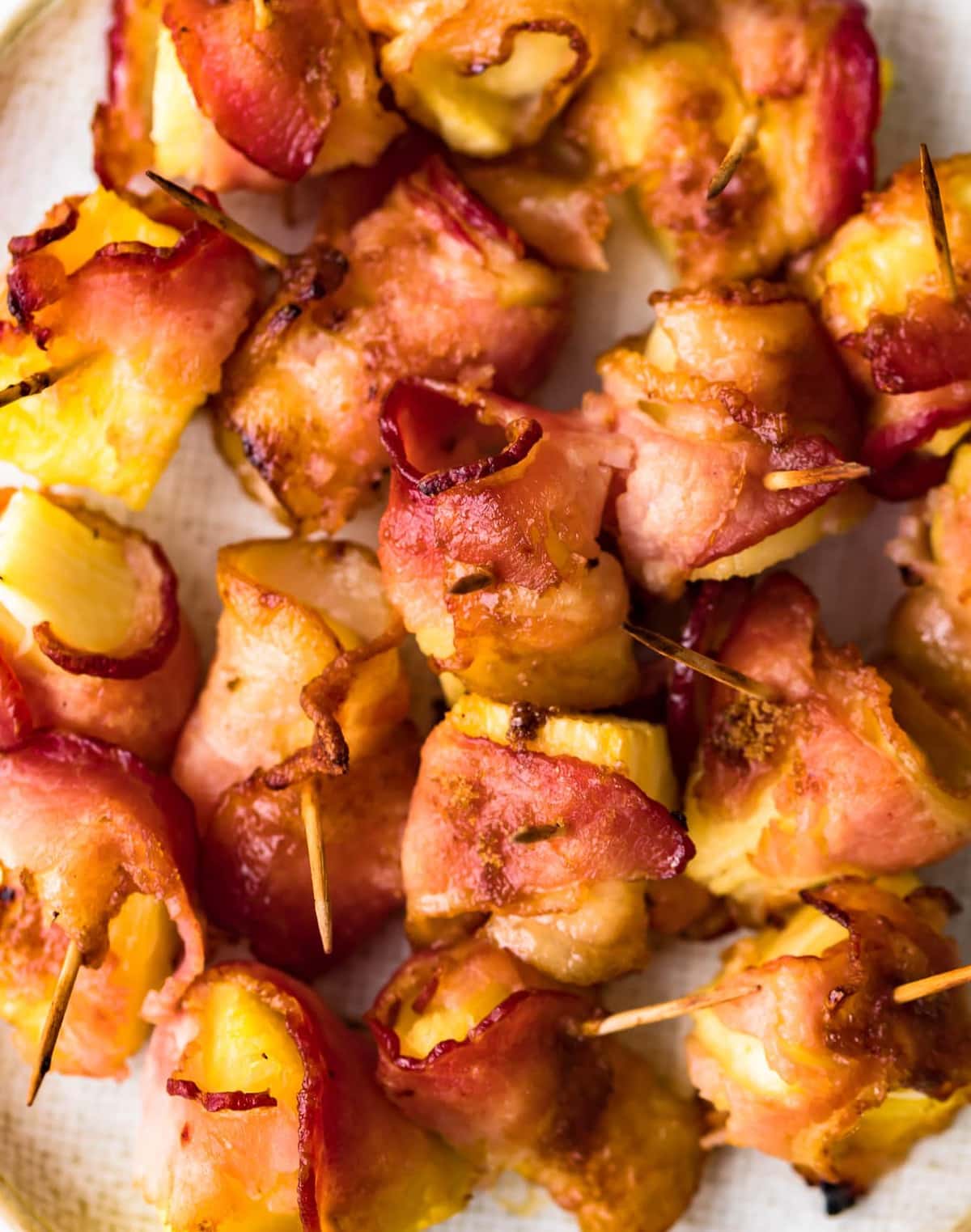 Crispy bacon wrapped around chunks of pineapple