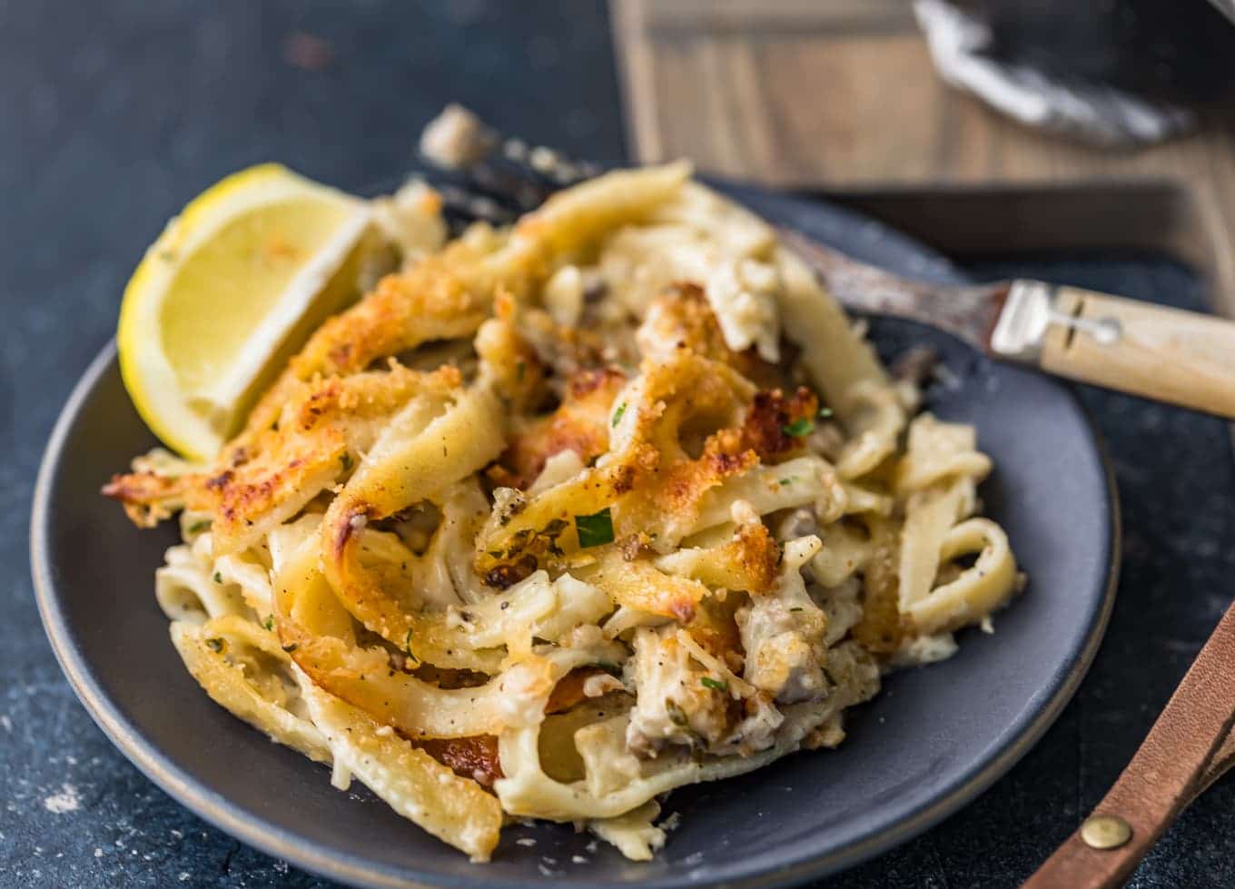 Chicken tetrazzini served on a black plate