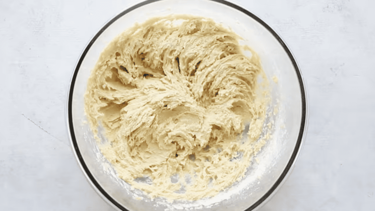 edible cookie dough batter in a glass bowl.