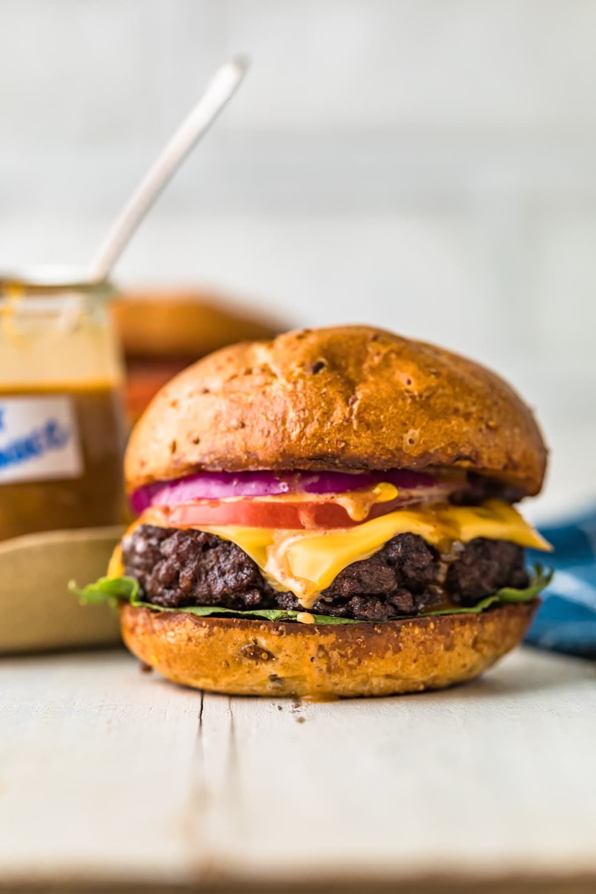 Close up of a juicy grilled burger with toppings