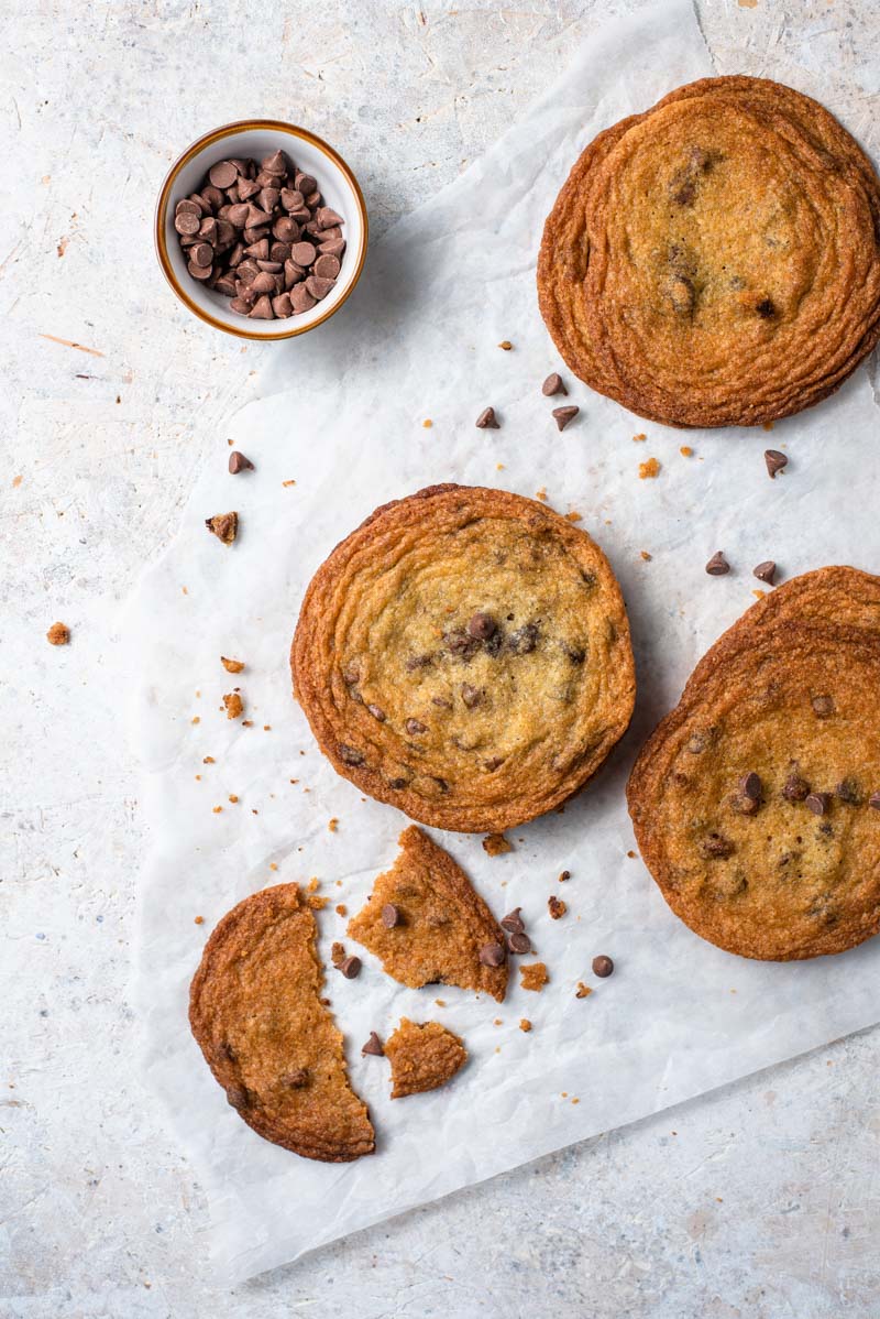 An overhead shot of Brown Sugar Cookies with Chocolate Chips on parchment paper.