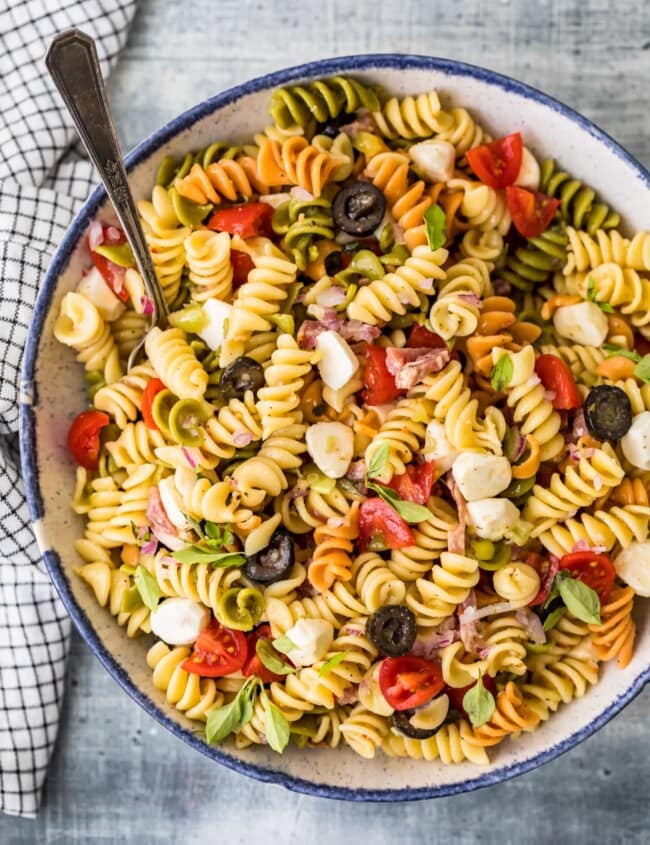 italian pasta salad in a bowl with a spoon