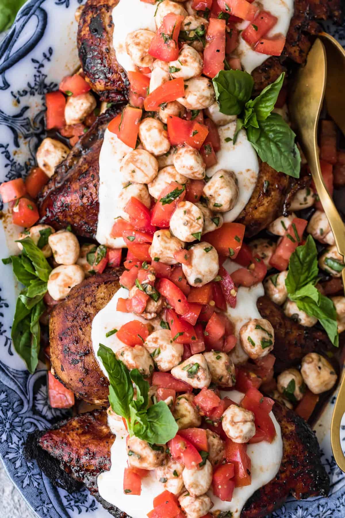 detailed view of bruschetta and caprese on chicken