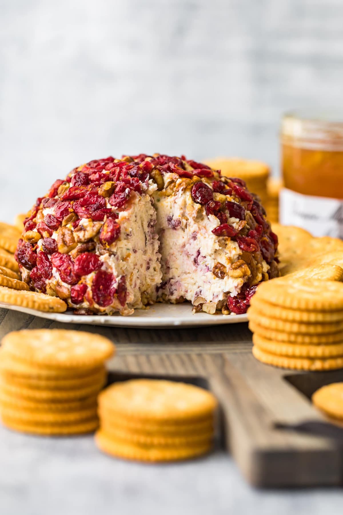 A cheese ball with a section cut out of it