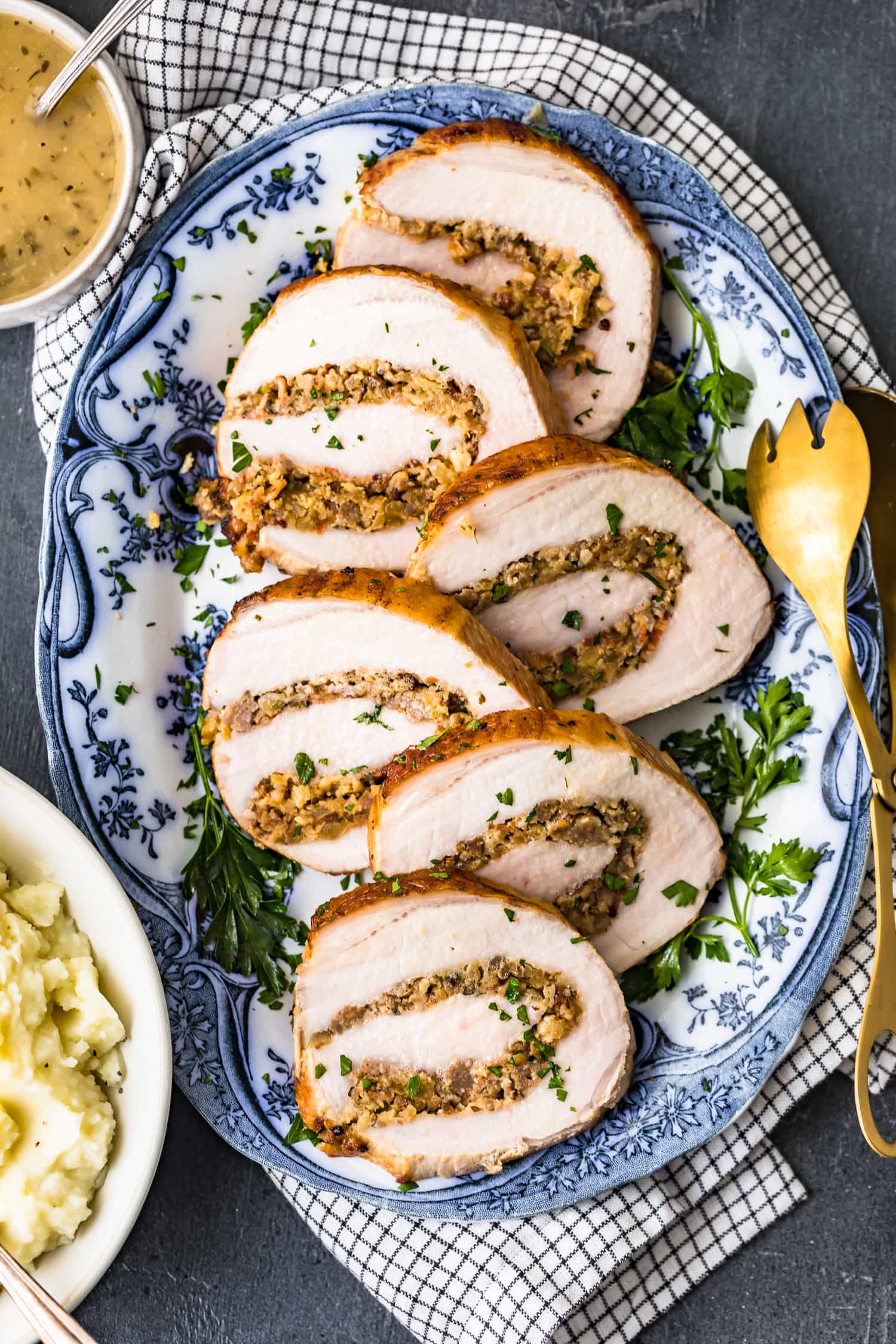 Slices of pork on a blue and white serving plate