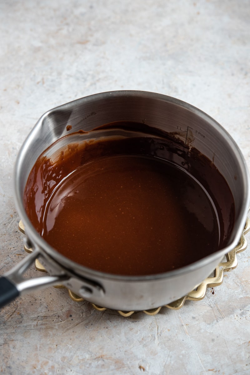 Melted chocolate in a pot for making Lava Cakes with Peanut Butter.