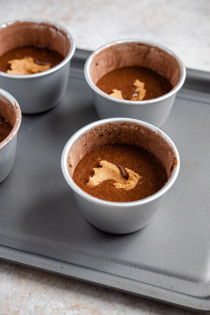 Chocolate lava cakes in ramekins ready for the oven