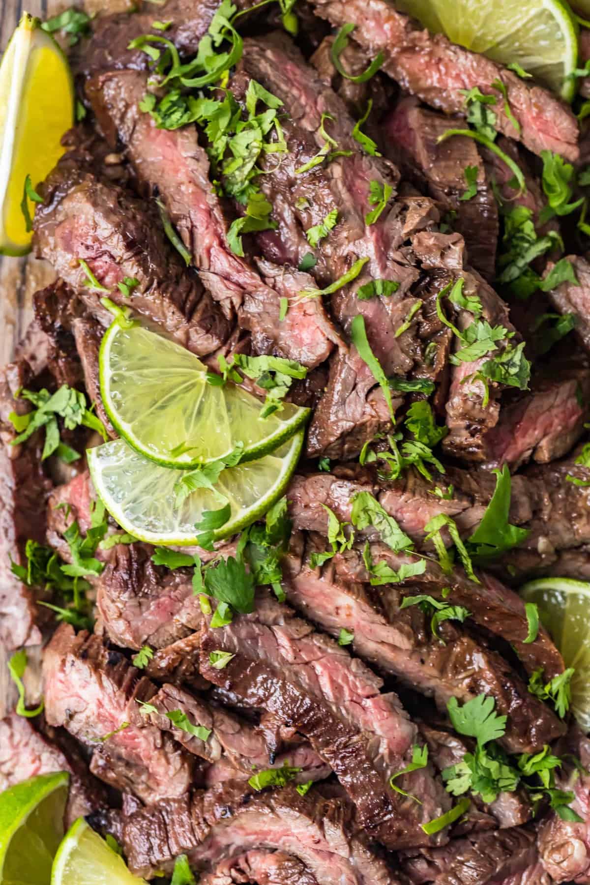 Close up of Carne Asada Steak with lime slices