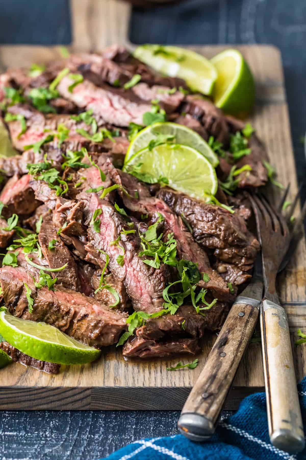 Sliced beef on a wooden chopping board