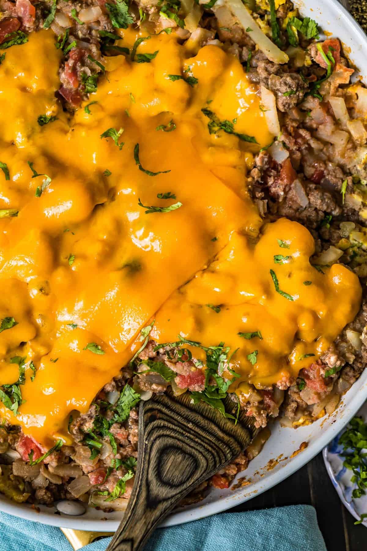 Beef Breakfast Scramble in a skillet with a wooden spoon