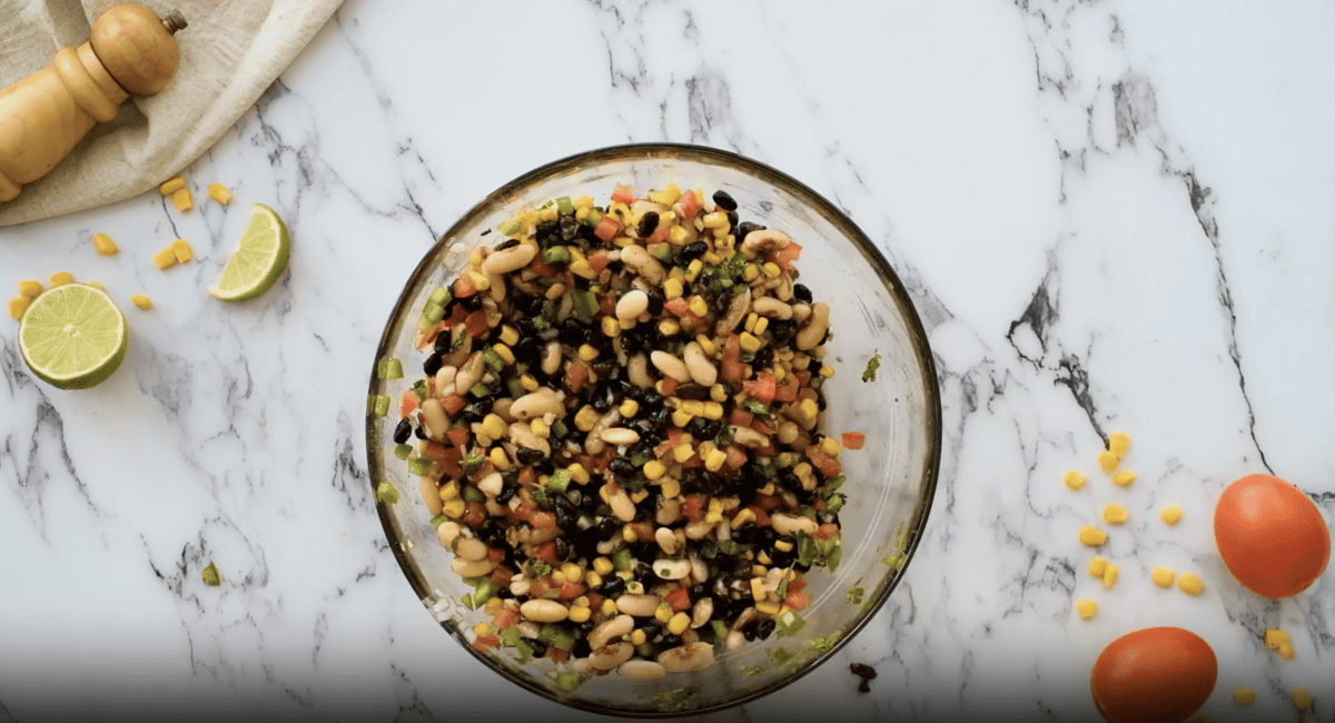 a bowl of beans and veggies.