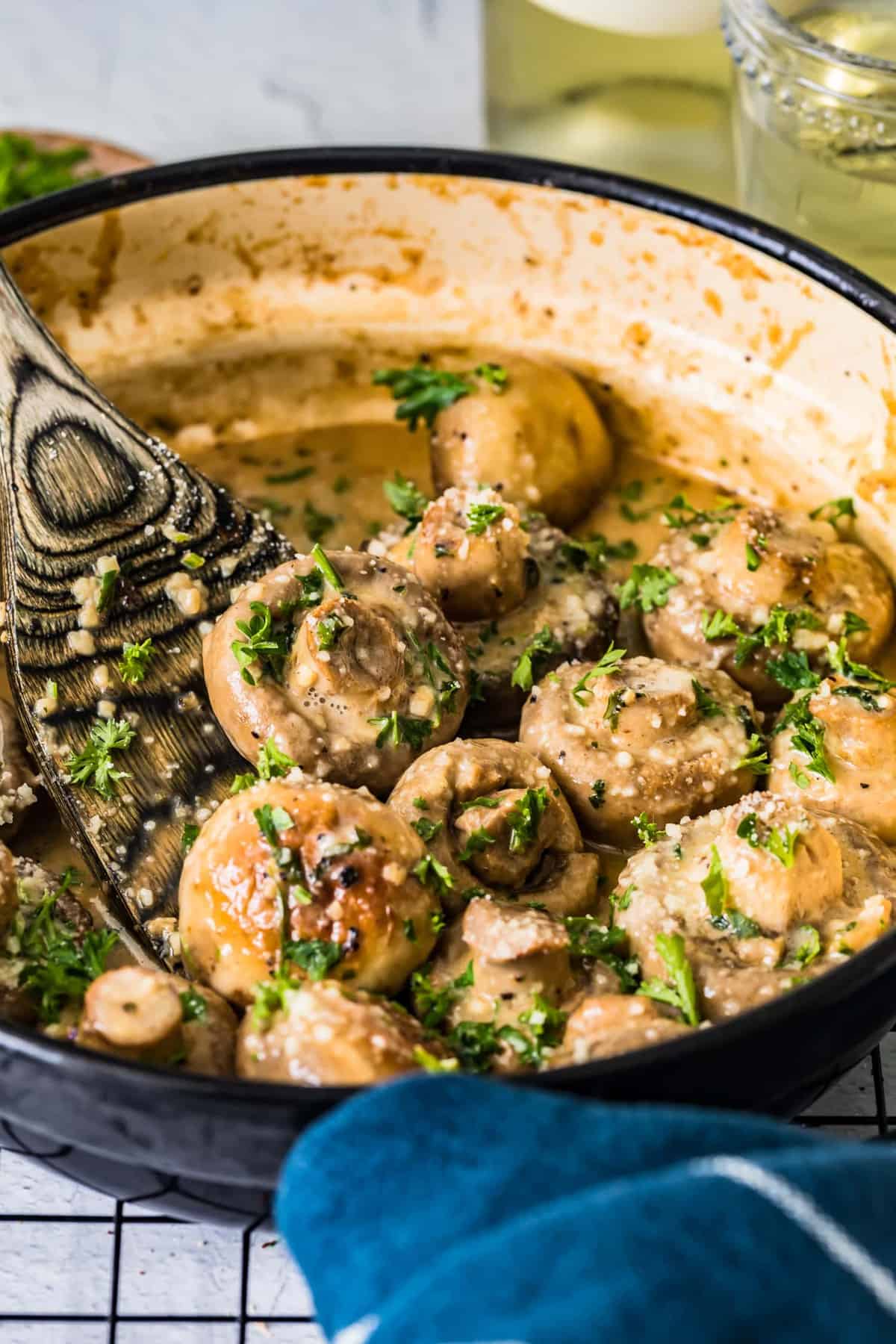 Close up of fresh parsley sprinkled on mushrooms