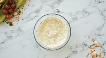 cream cheese in a glass bowl.