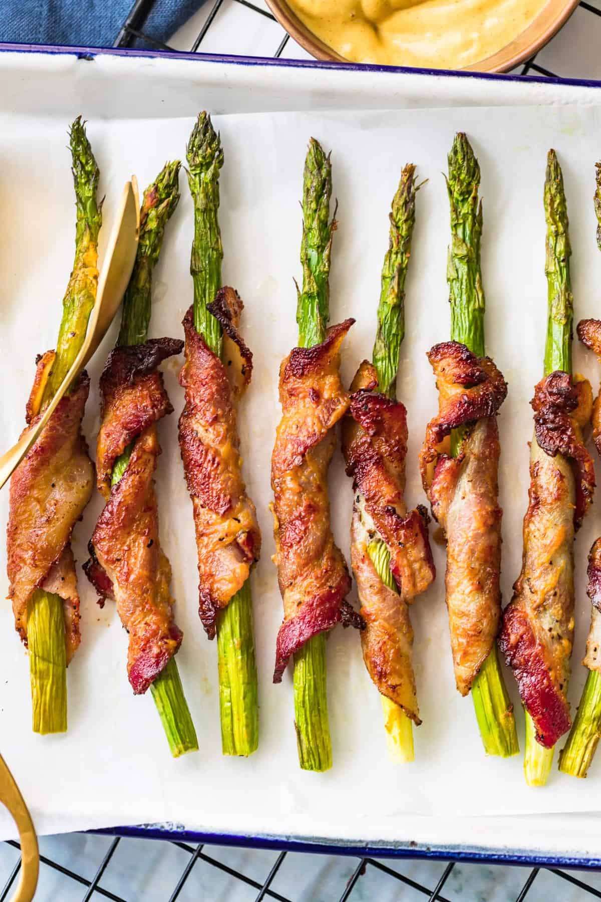 Bacon Wrapped Asparagus in a white tray