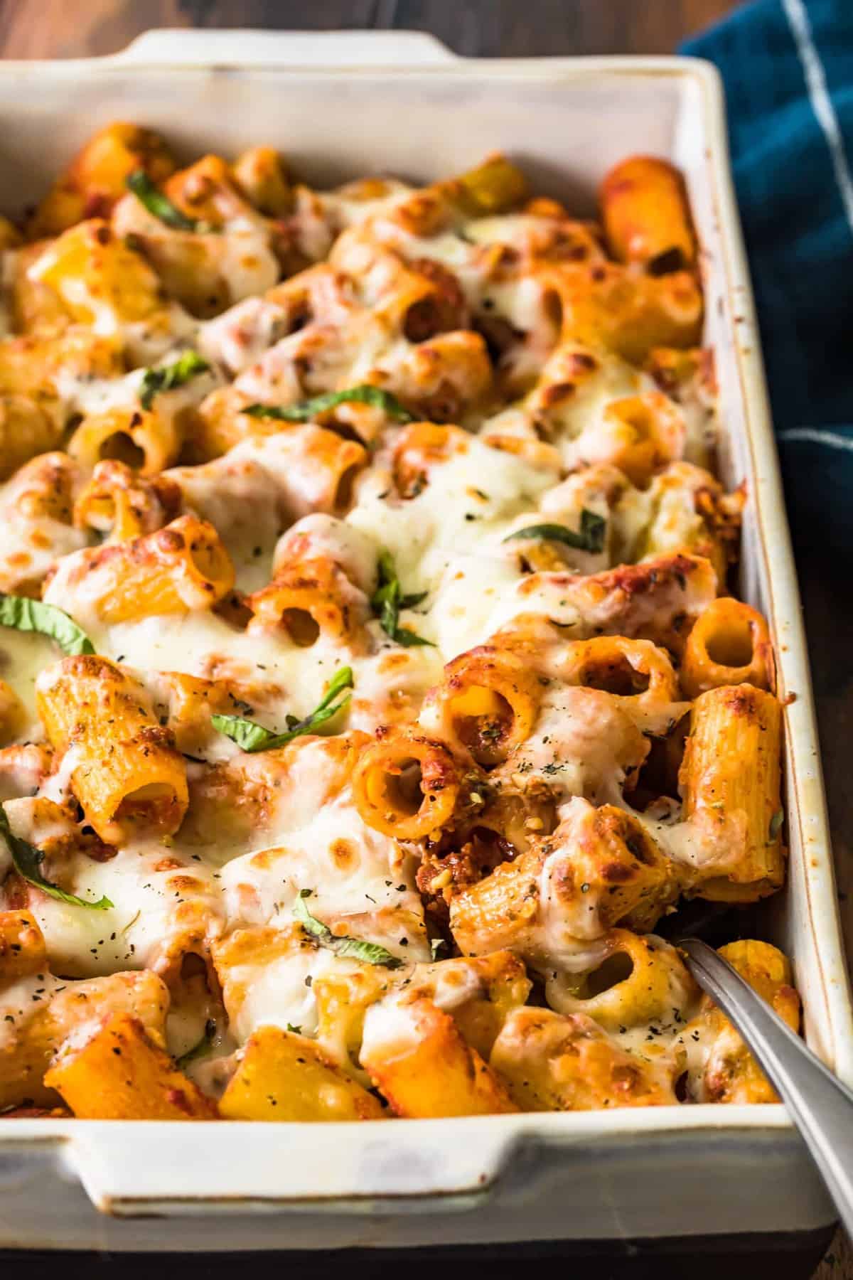 Baked rigatoni in a white casserole dish