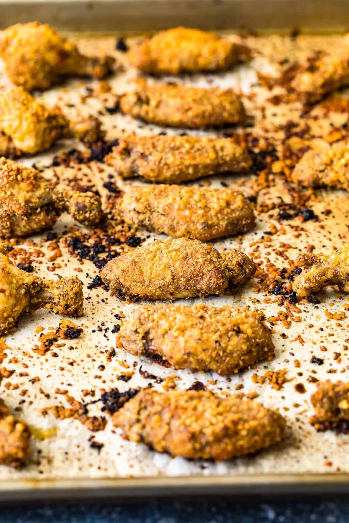 Baked chicken wings on a baking sheet