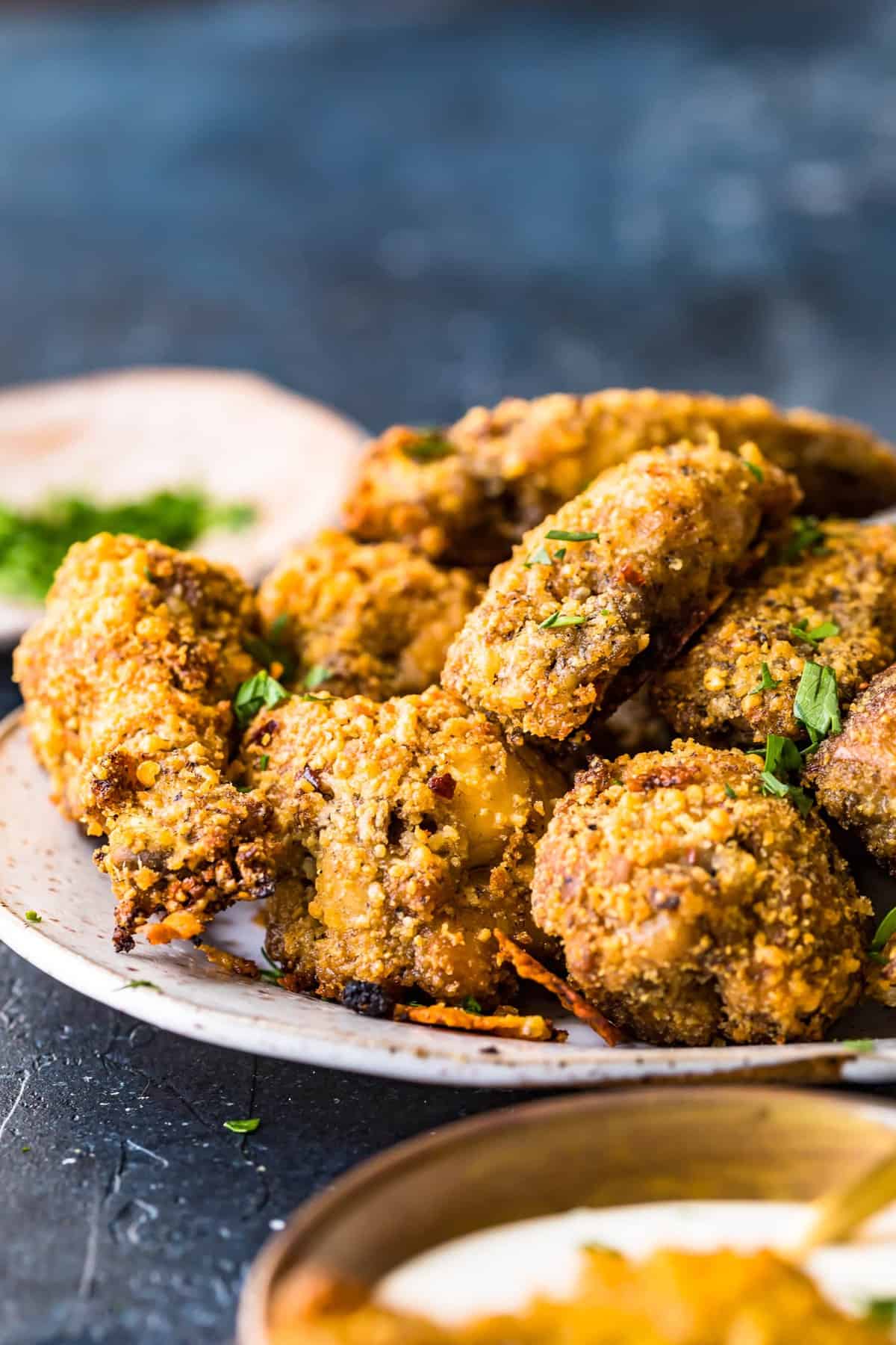 Garlic Parmesan Chicken Wings piled high on a plate