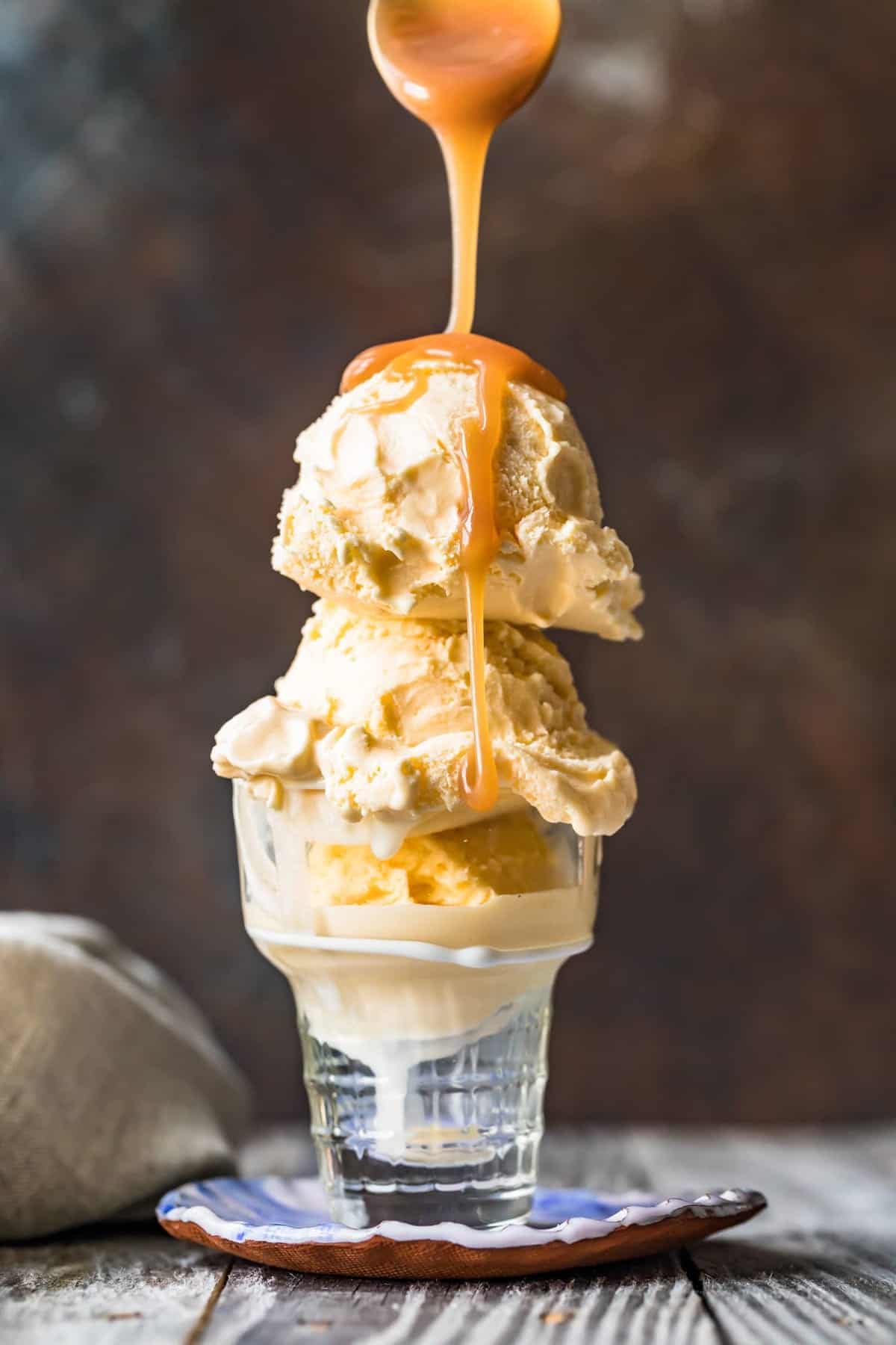 Sauce being drizzled over an ice cream