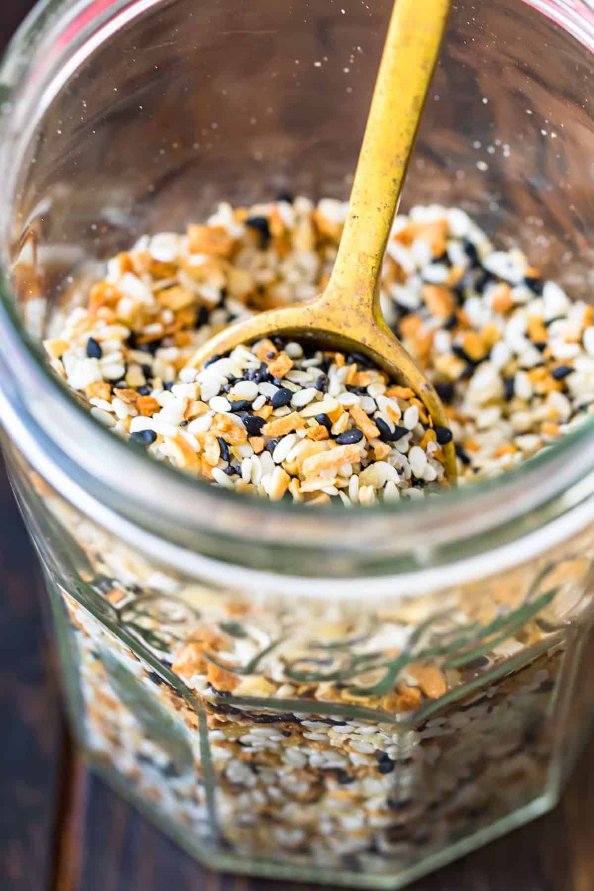 spoon scooping seasoning out of jar