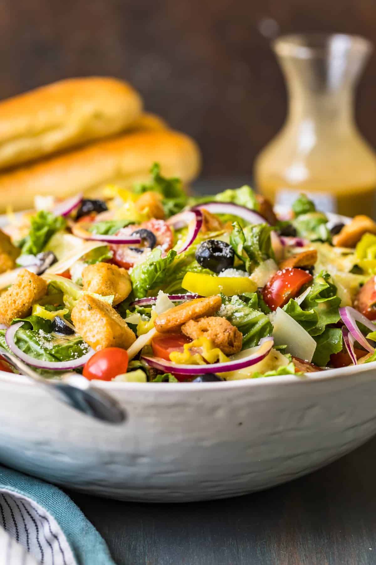 Side view of the Olive Garden salad in a large white bowl