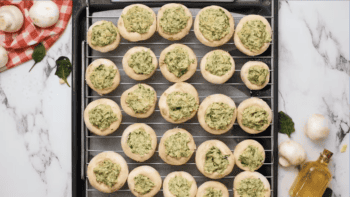 Spinach Stuffed Mushrooms on a rack.