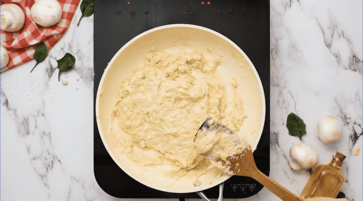 artichoke filling thickened with cream in a pan.