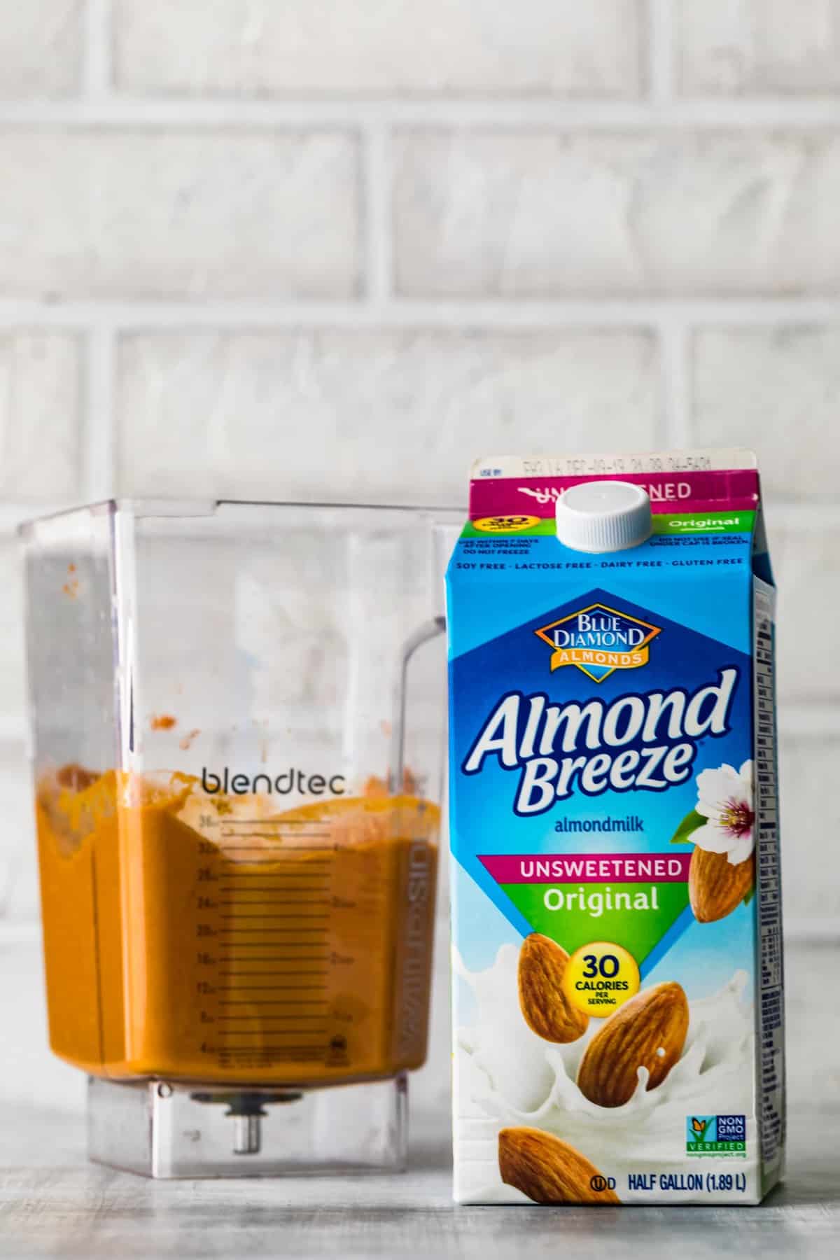 almond breeze next to blender of smoothie