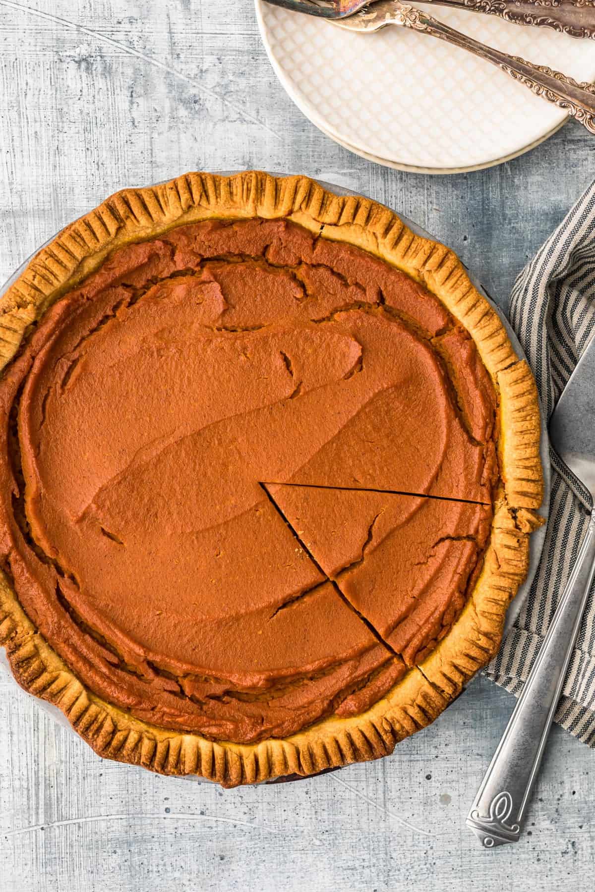 pumpkin pie with slice cut