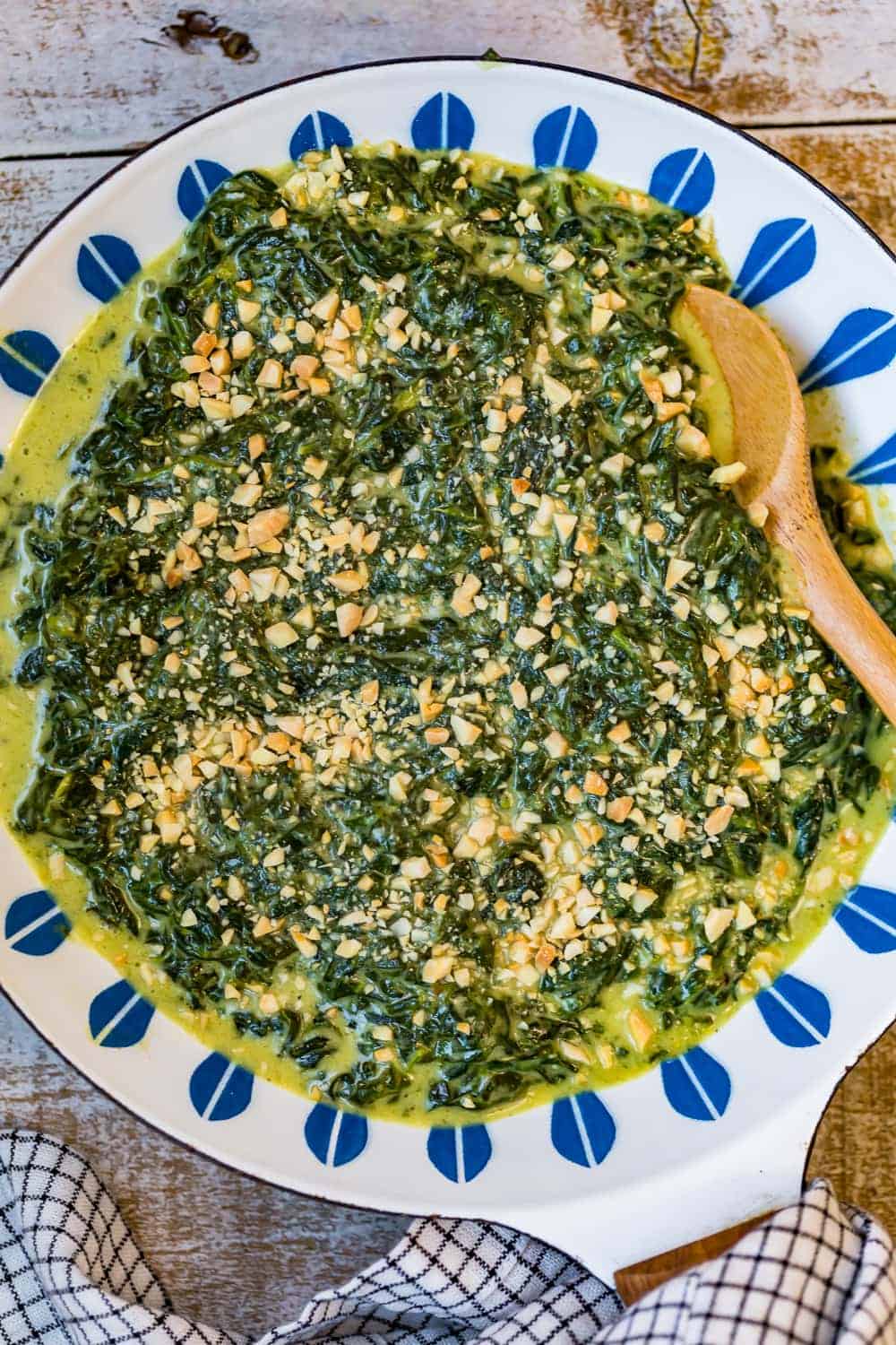 Creamed spinach served in a blue and white bowl