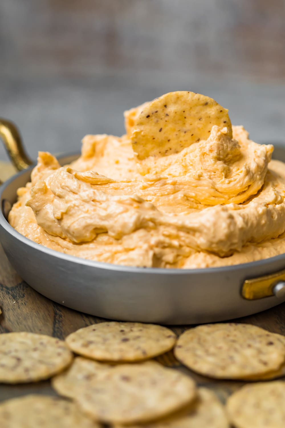 Beer Cheese Dip served in a silver bowl with crackers