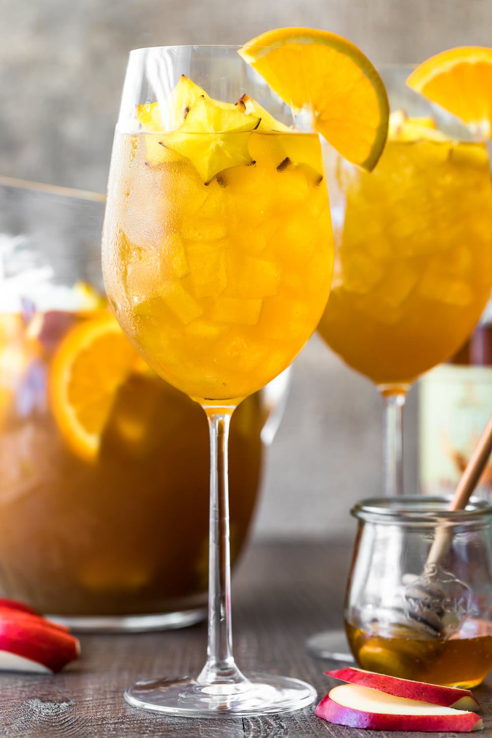 A wine glass garnished with fresh fruit