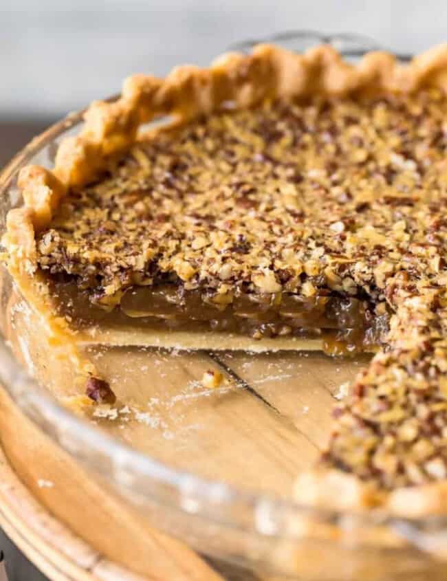 A Classic Pecan Pie with a slice taken out.