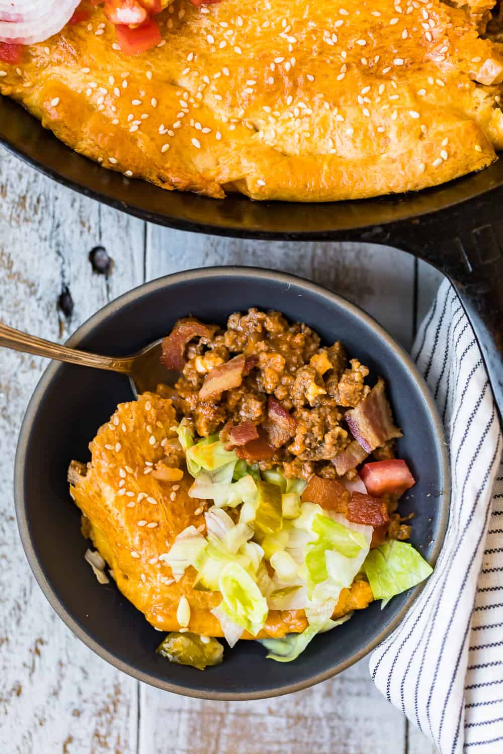 overhead shot of bacon cheeseburger pot pie in bowl