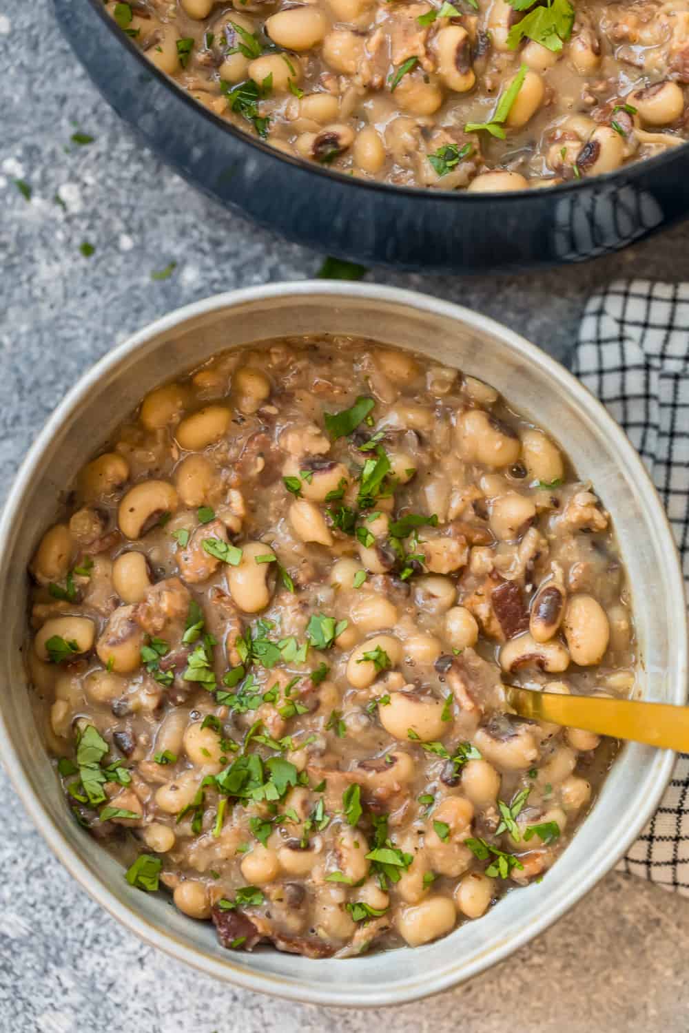 bowl of soup filled with beans and bacon