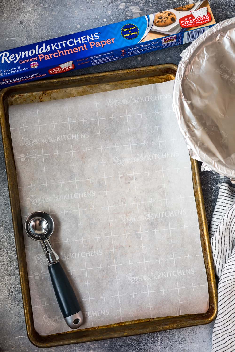 cookie sheet lined with reynolds kitchens genuine parchment paper