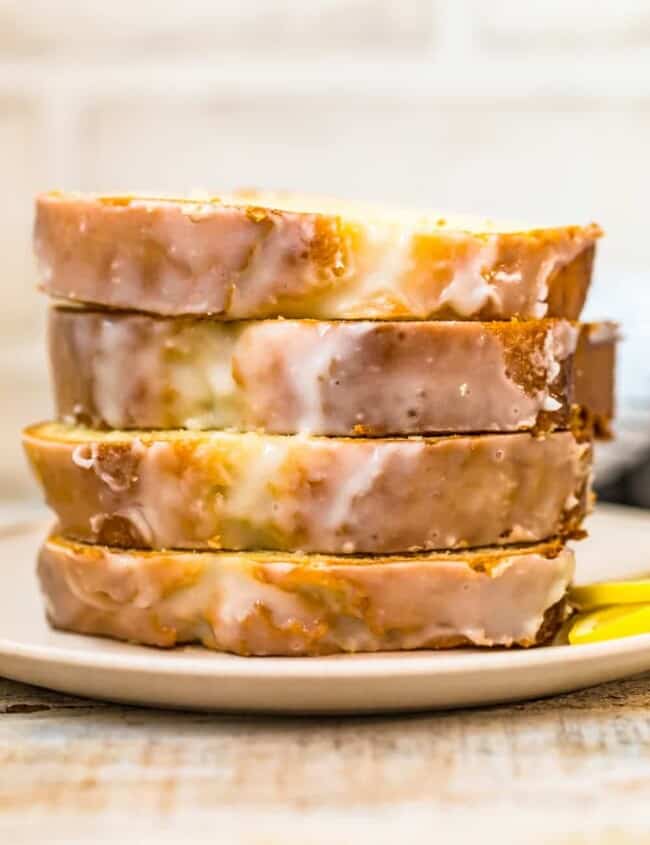 slices of lemon loaf cake stacked on a plate