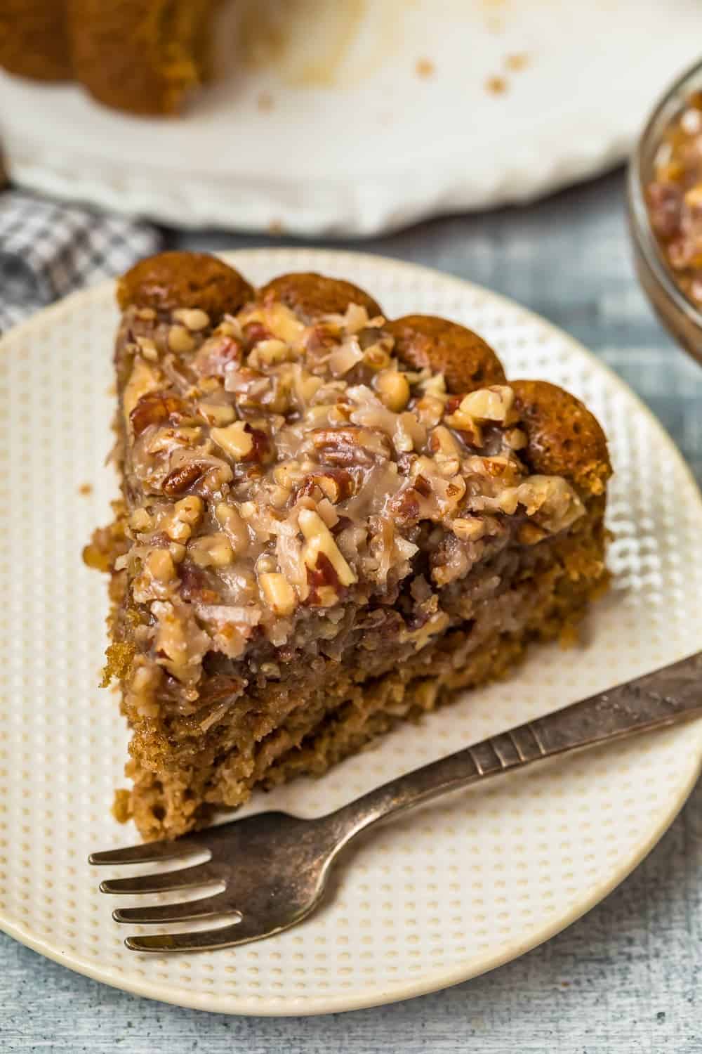 A slice of Old Fashioned Oatmeal Cake on a white plate