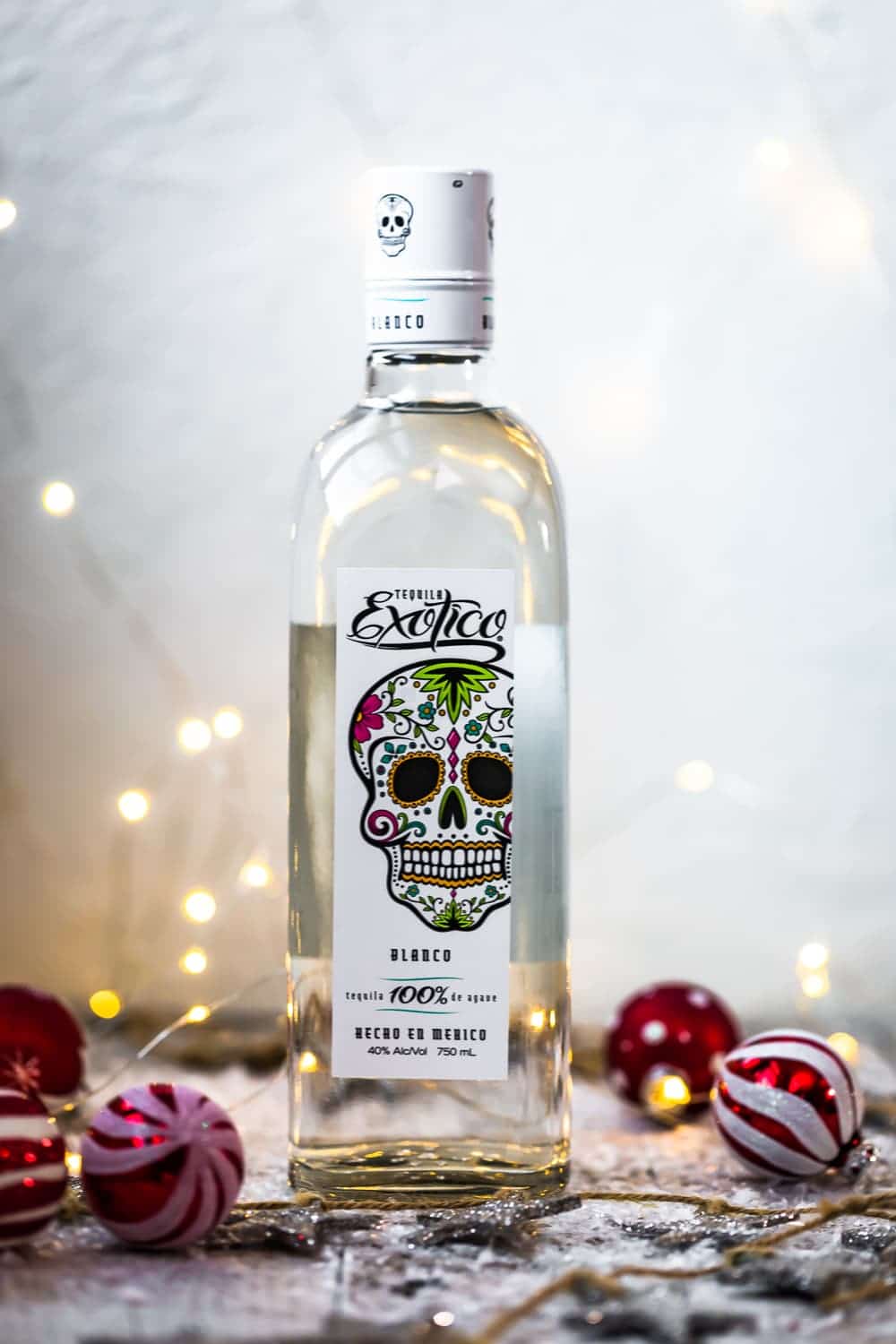 exotico tequila in bottle in christmas scene