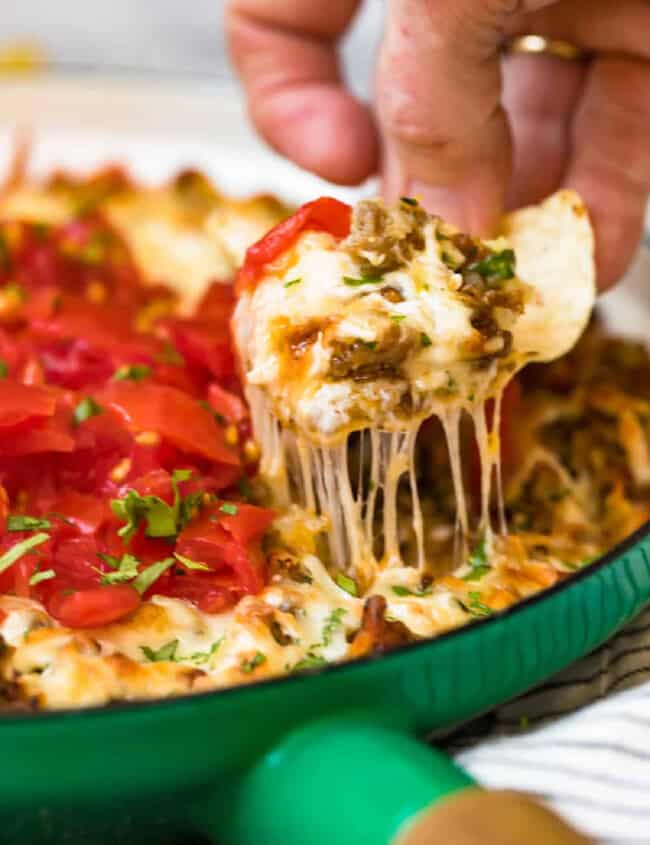 chip lifting up queso fundido