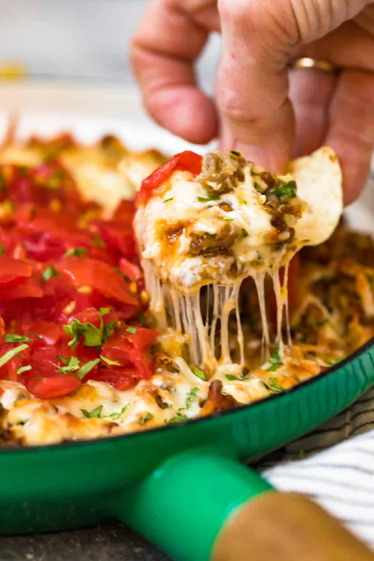 chip lifting up queso fundido