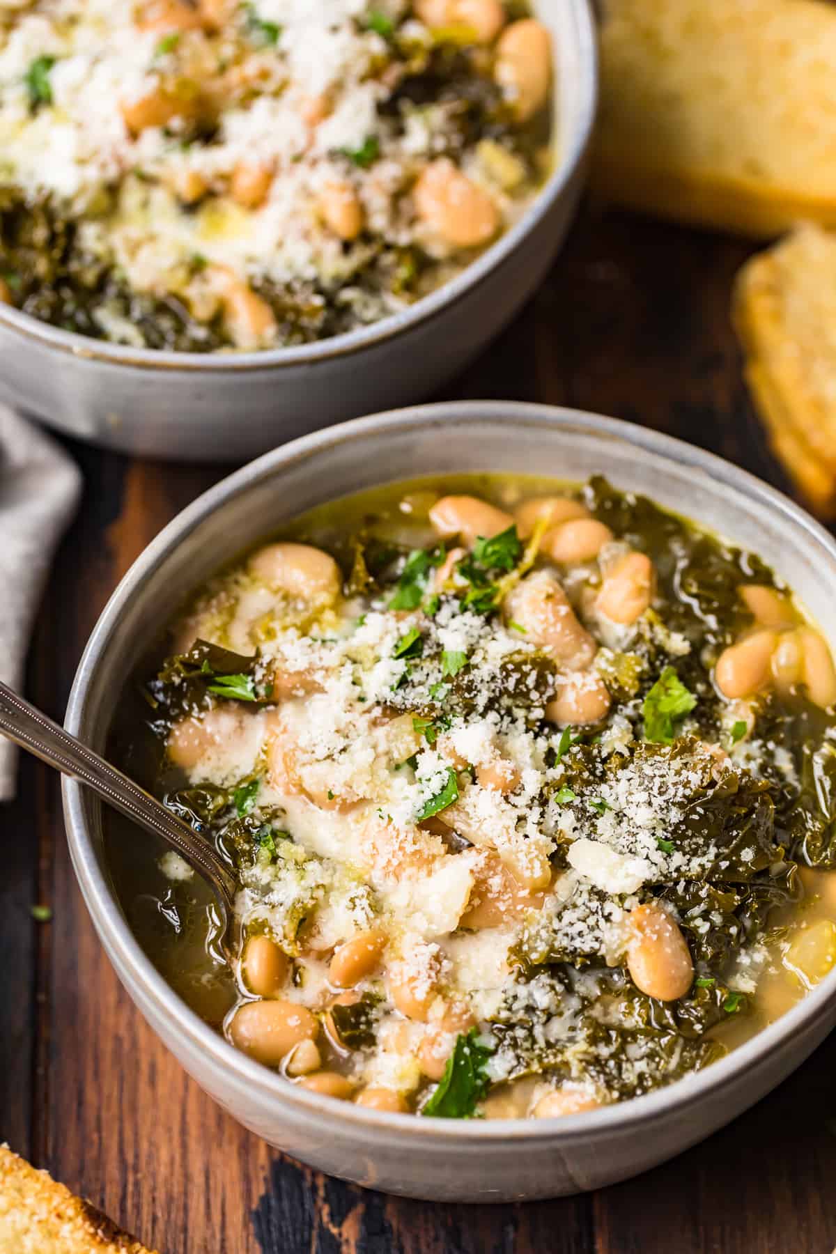 spoon in bowl of white bean soup