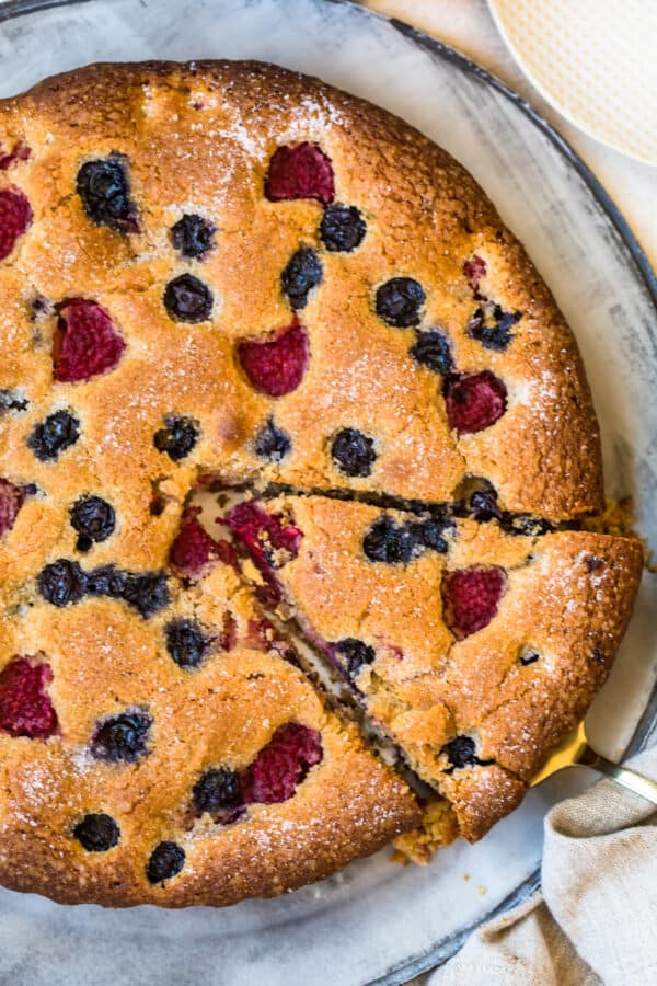 A slice being removed from the Blueberry Raspberry Coffee Cake