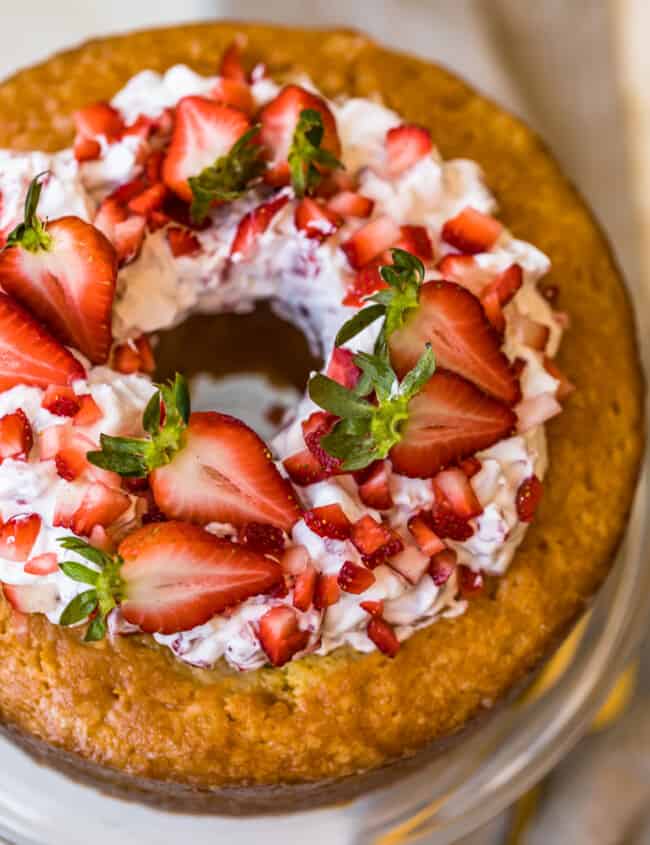 butter cake and strawberries and cream on a cake plate