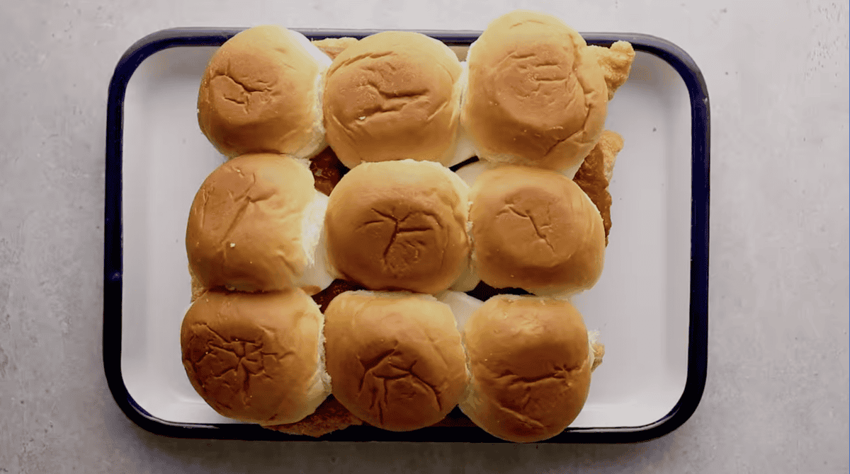 chicken parmesan sliders on a baking pan.