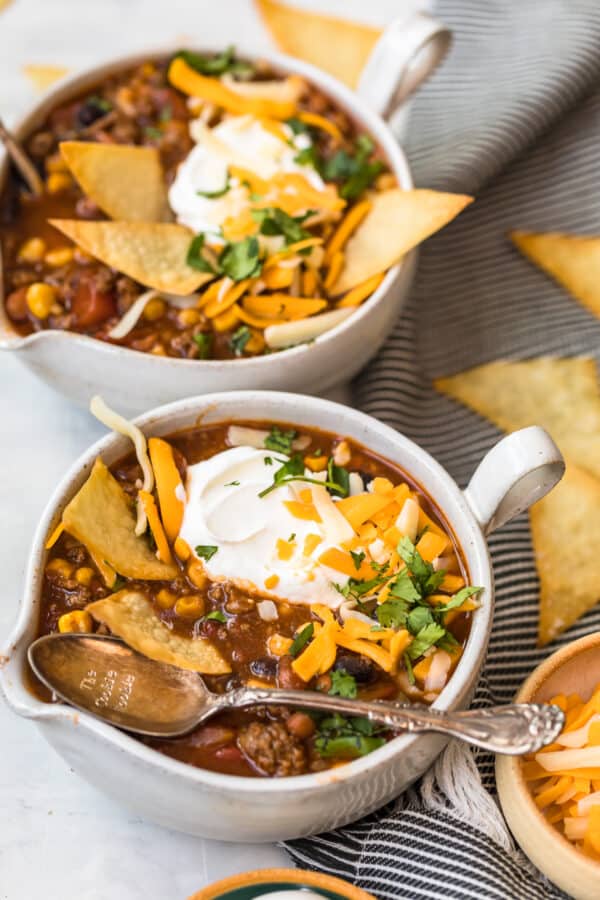 Taco soup served in two white bowls