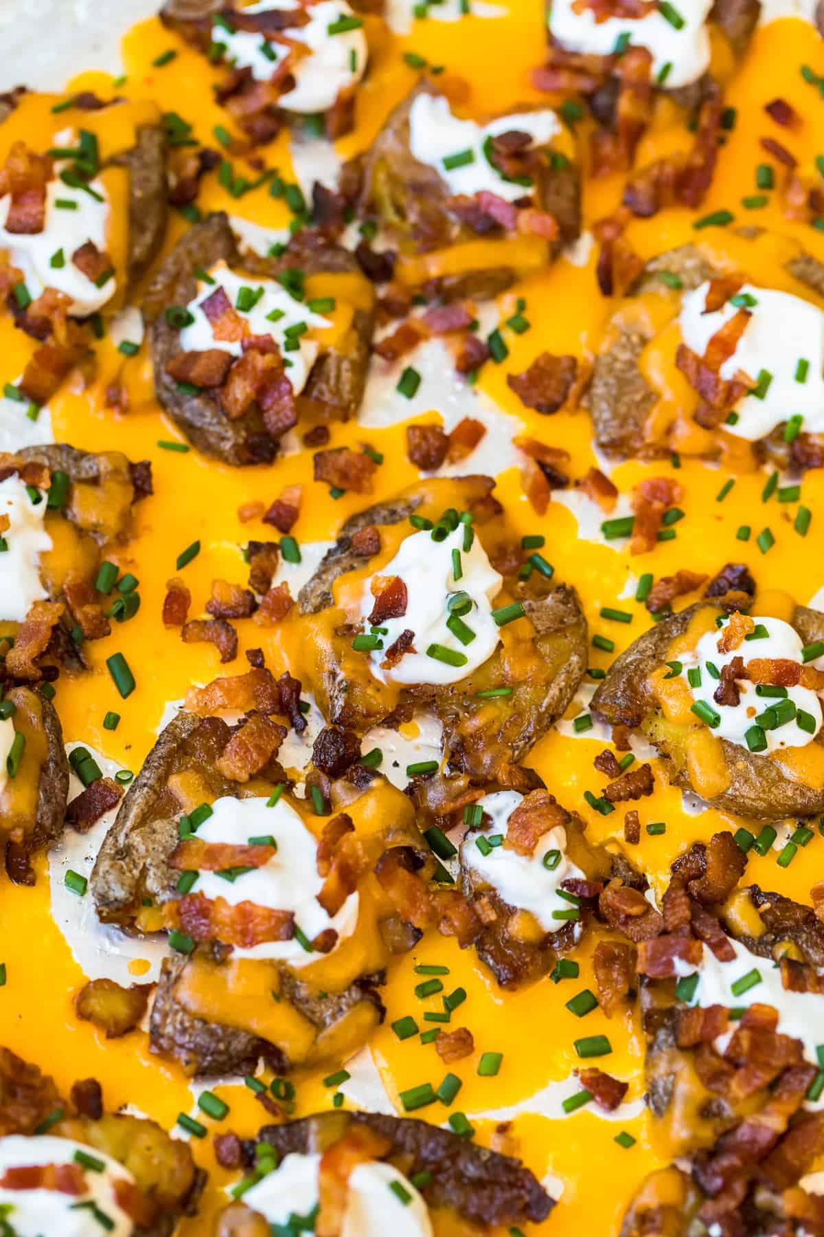 Loaded Smashed Potatoes on a baking sheet